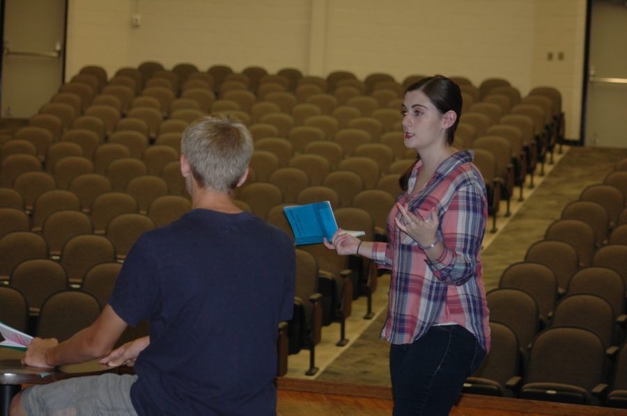 Ms. Christina Duris, new fall play director, gives stage directions to McGwire Holman, sophomore, in an individual scene practice in preparation for Almost, Maine on Aug. 31.