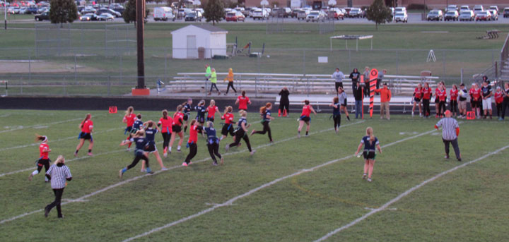 At+the+2015+Powderpuff+game%2C+juniors+and+seniors+squared+off+in+what+has+become+a+Homecoming+tradition.+