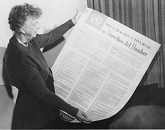 Eleanor Roosevelt, U.S. delegate to the United Nations, holds a copy of the Universal Declaration of Human Rights in 1948.