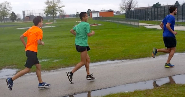 Senior Justin Tutt, sophomore Seth Joder, and senior Matt Mason start their road run on a rainy day of practice.  “The run felt good. It was nice and cool out,” Tutt, said.  Although he faced challenges this season, Tutt looks to his teammates to remind him to stay positive and keep his confidence high, because cross country has a way to reward the runner who really want to succeed. 