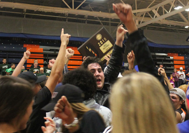 Minooka fans celebrate the girls volleyball team winning the sectional championship on Nov. 3.