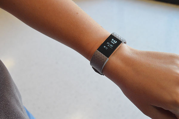 Taylor Billie, senior, shows off her Ultra 2 Fitbit. She has been using Fitbit products since 2013. 
