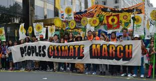In the midst of a crowd of 310,000, several climate change activists hold up a sign to raise awareness and promote research on behalf of global climate action at the 2014 Peoples Climate March in New York.
This event laid the foundation for the March for Science on Washington that will occur on Earth Day, April 22, 2017.

This will give the world a chance to be more open about scientific ideas and benefit not only the scientific community, but the world, said Aiden Cordon, sophomore.