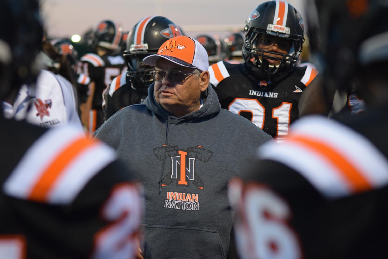 Head coach Terry McCombs addresses the Minooka team during a game against Joliet Central on Sept. 1.  The Indians defeated the Steelmen 42-0.