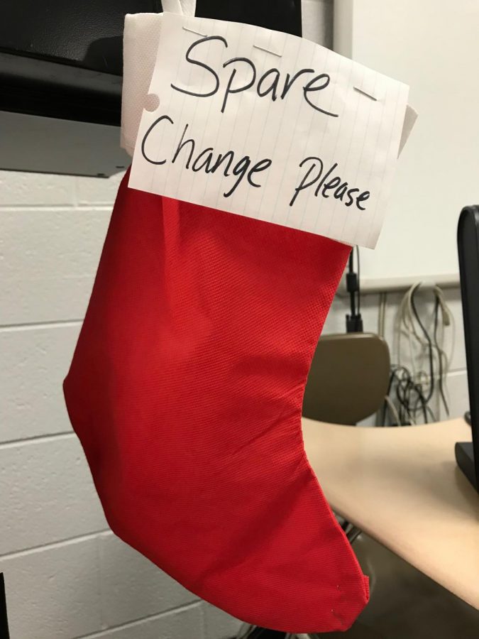 To help fund Lambs Fold, a womens shelter in Joliet, students fill stockings like this one in Ms. Ann Rapskys room at Central Campus.