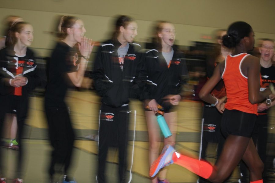 Emily Johnson runs in the 4x400-meter relay at the Wheaton Warrenville South Invitational on Feb. 10. Minooka finished 2nd in the race and 2nd as a team at the meet. 