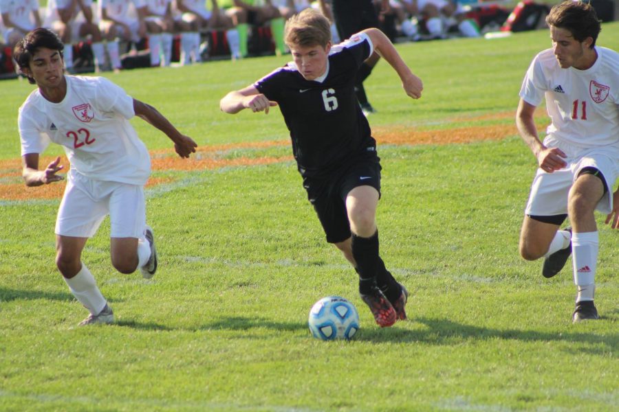 Junior Ryan Felgenhauer takes the ball against Naperville Central on Aug. 23.  The game ended in a 1-1 tie. 