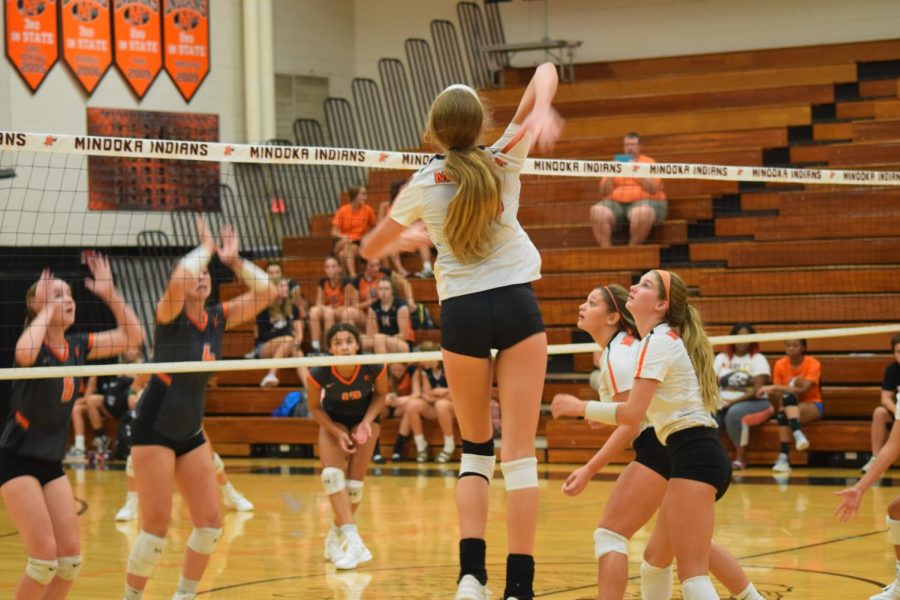 Heidi Bonde, sophomore, prepares to spike the ball against her opponents on Aug. 17 at Meet the Indians.