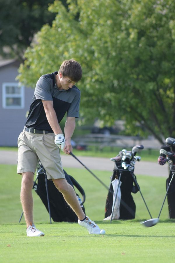 Senior Dylan Pfieffer tees off at Heritage Bluffs. Minooka has beaten both of its conference opponents thus far this year. 