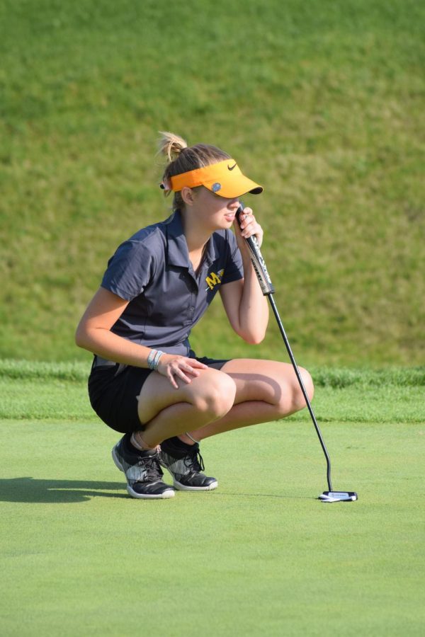 Megan Chiappetta lines up a putt early in the season at Heritage Bluffs.  She was one of four MInooka girls to qualify for sectionals. 