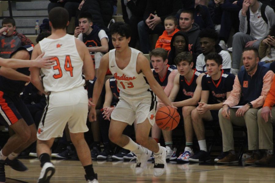 Carlos+Hernandez+handles+the+ball+against+Oswego+on+Dec.+14.+