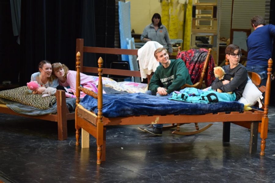 Ashley (Emily Maruszak, senior), Katie (Grace Preboy, junior), Dad (McGwire Holman, senior), and Wally (Dominic Alberico, junior) watch the final tale of the show taking place on the opposite side of the stage. Childrens Theater performs at Central Campus on Feb. 5 at 7 p.m.