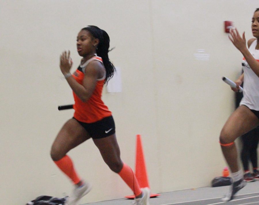 Sophomore Kyndall Ross leads off the 4x200-meter relay at the Wheaton Warrenville South Invitational on Feb. 9. The relay team finished fifth. 