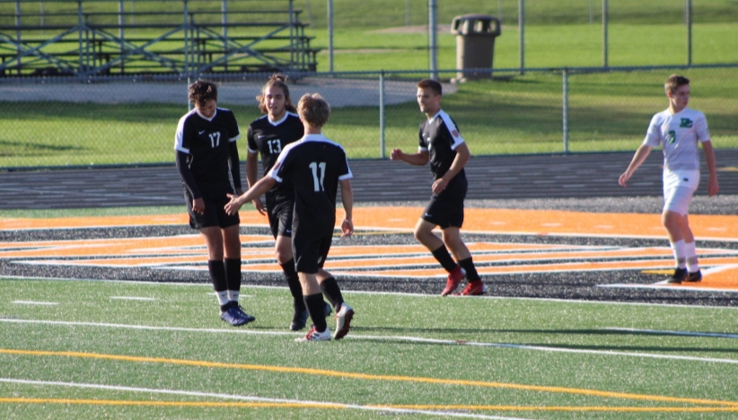Ten minutes into the first half of the game against Providence, Ben Joder, senior, scores making it a 1-0 game. As the team was walking back into position, they high-fived and thanked Joder for his powerful strike that gave them an early lead.
