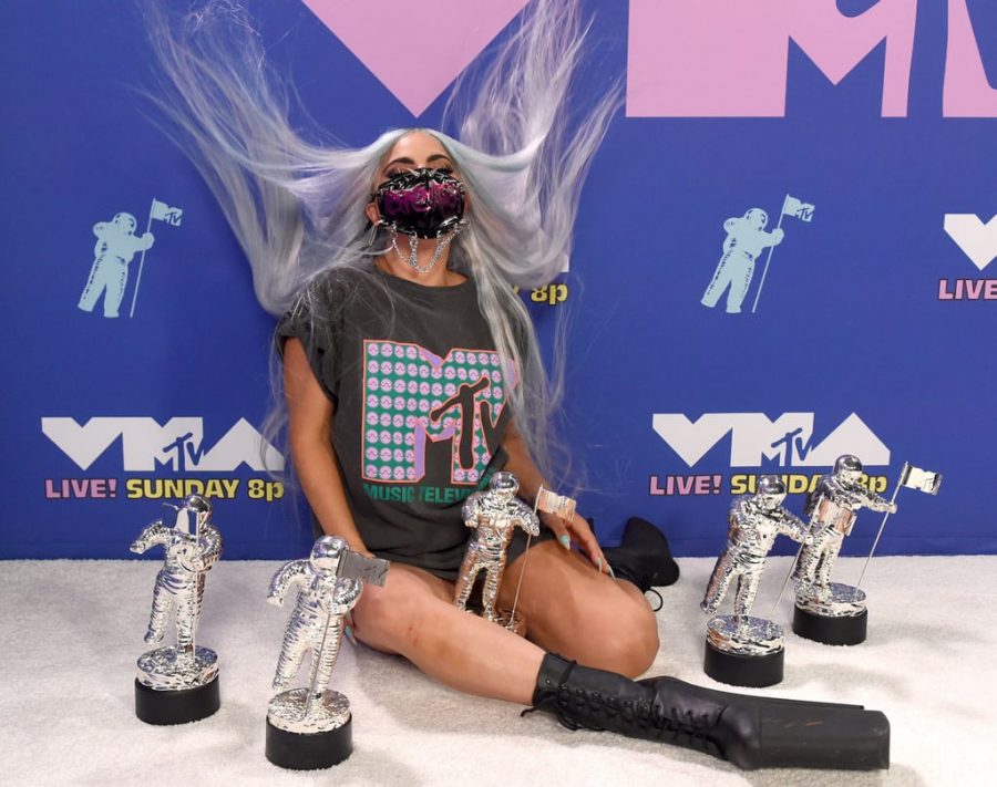 Lady Gaga, the biggest winner of the night, poses with her 5 VMAs she won throughout the show for Artist of the Year, Song of the Year, Collab of the Year, Best Cinematography, and the first ever Tricon Award.