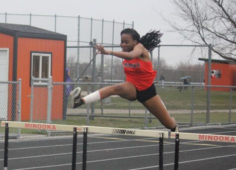 Freshman Bre Edwards wins the 300-meter low hurdles in a triangular meet against Plainfield North and Romeoville on April 12. 