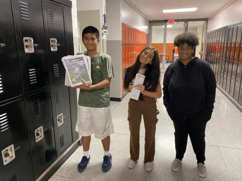 Mark Meszaros, Bella Nino, and Hannah McGrew deliver the first issue of Nook News to classes in the English hallway at Central Campus on Oct. 6. 