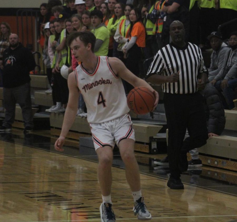 Senior Preston Van Pelt handles the ball against Oswego East on Dec. 2.