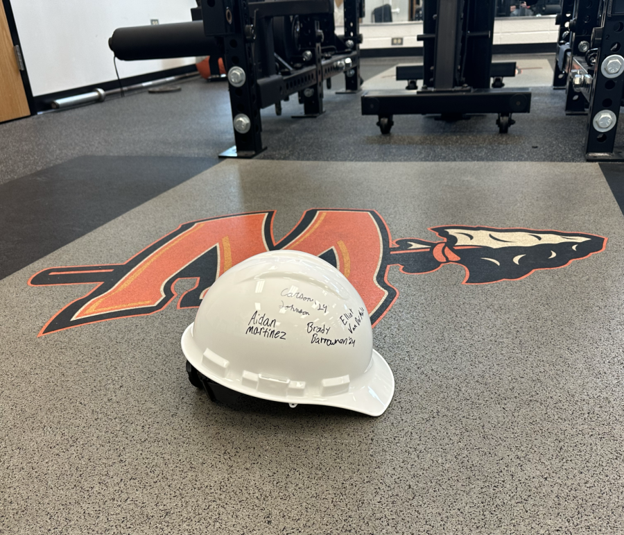 The Hard Hat in the weight room is part of a new philosophy for the football players.