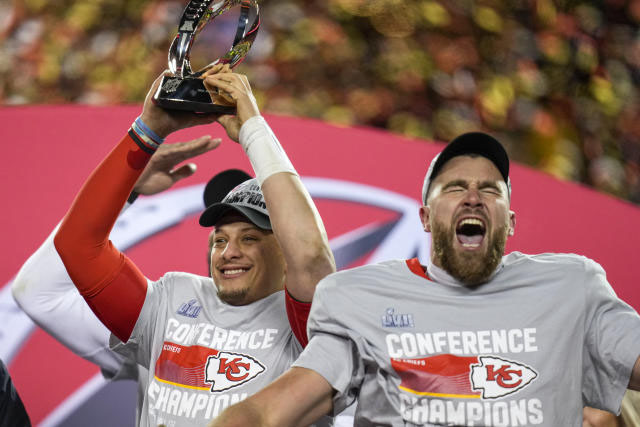 Kansas City Chiefs star players Patrick Mahomes and Travis Kelce hoist the AFC Championship trophy. The Chiefs emerged victorious, 23-20, thanks to a late 4th quarter field goal by Harrison Butker.