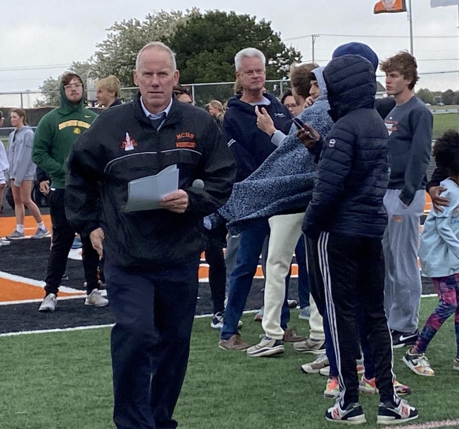 Athletic+director+Bob+Tyrell+helps+prepare+ceremonies+for+Senior+Night+at+the+boys+track++and+field+meet+on+May+2.+Tyrell+is+retiring+this+year+after+working+at+MCHS+since+1995.+