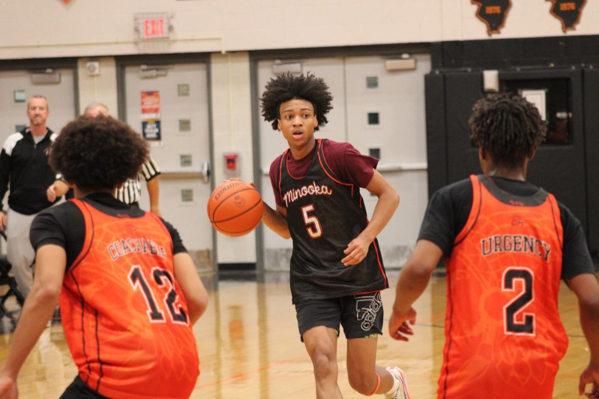 Senior Jahmai McCoy brings the ball up the court at an early season scrimmage. 