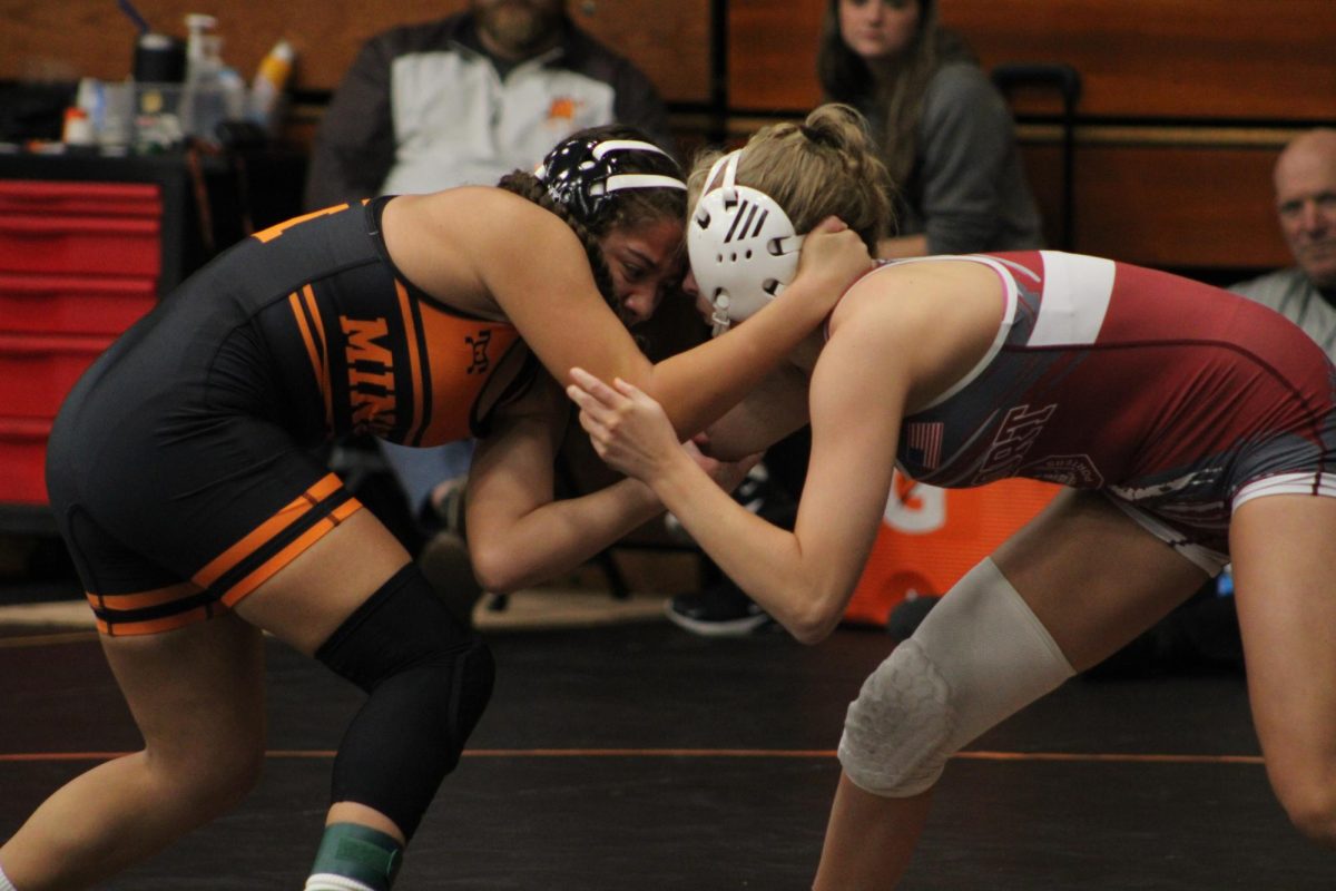 Attempting to get out of the head-to-head battle, junior Elizabeth Castro stays strong. The girls wrestling team had their Thanksgiving Throwdown tournament on  Nov. 22. Twenty-four teams came and over 300 girls wrestled for podium spots.