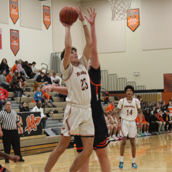 Wes Owens puts up a shot in Minookas win over Oswego on Dec. 8. 