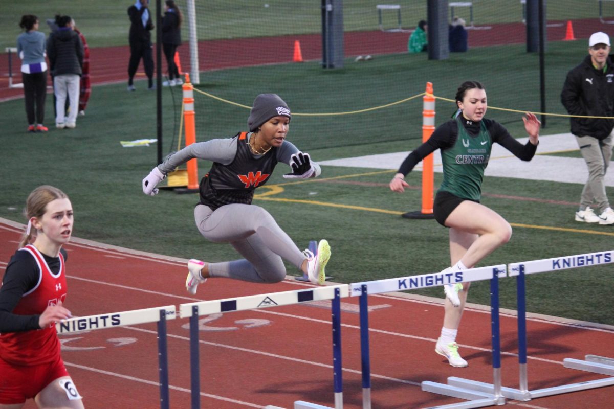 Clearing+her+first+set+of+hurdles%2C+junior+Nicole+McLaughlin+aims+for+a+better+time+in+the+100-meter+high+hurdles+at+Prospect+Relays+on+April+5.+She+set+a+new+personal+record+of+18.23+seconds.