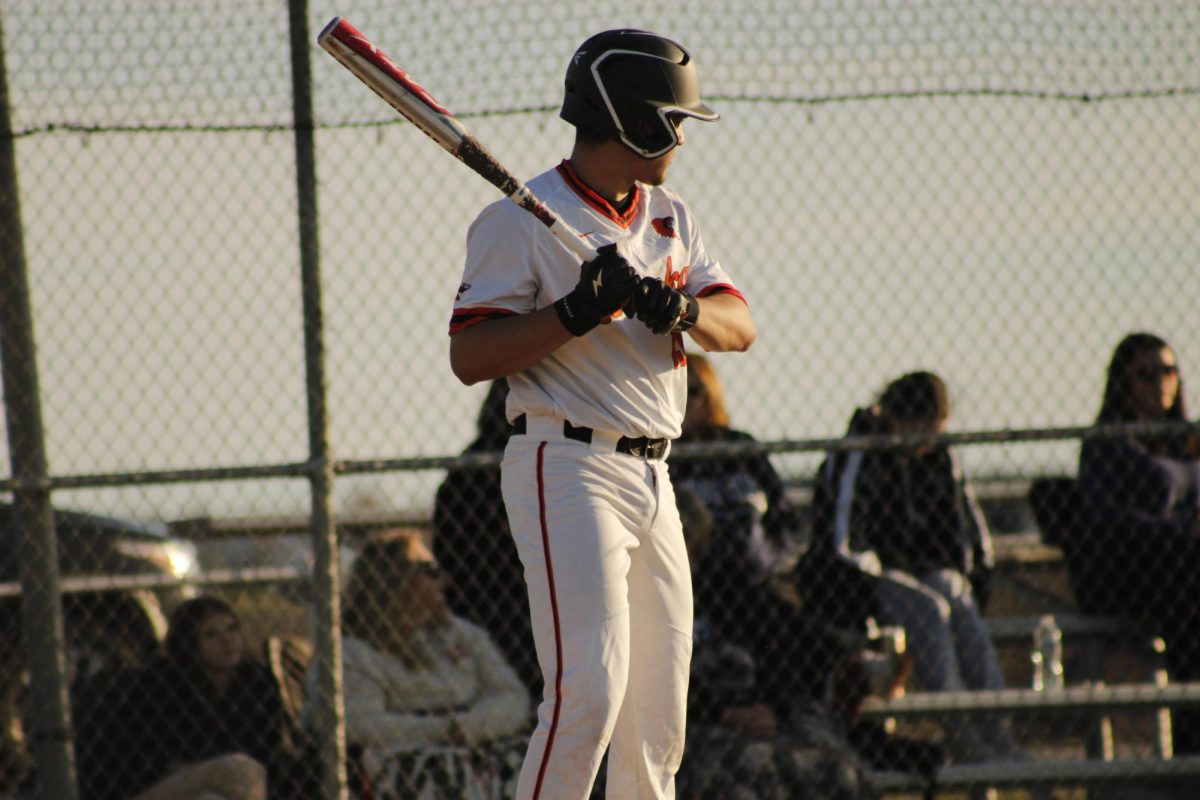 Junior+Mario+Jimenez+prepares+to+bat+against+Plainfield+South+in+the+7th+inning.++His+hit+would+push+a+run+across+and+give+Minooka+the+win.+