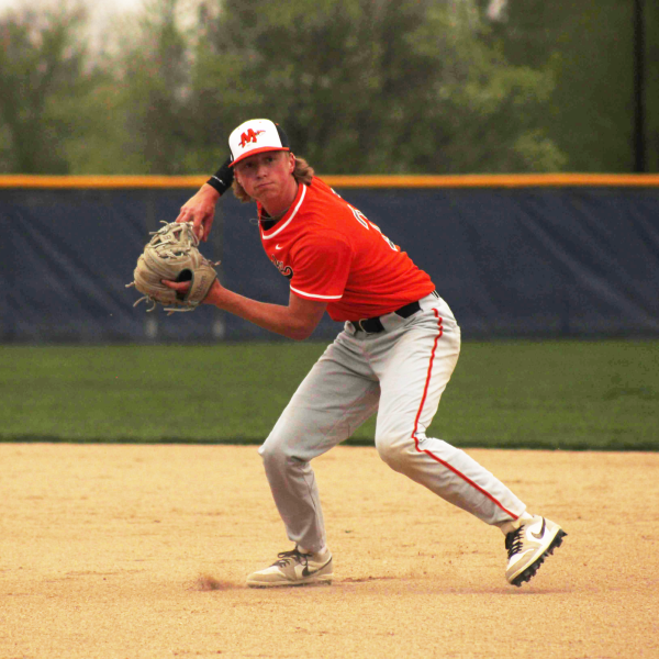 Junior second baseman Noah Pharo throws the ball to first during a game against Oswego East on April 18.