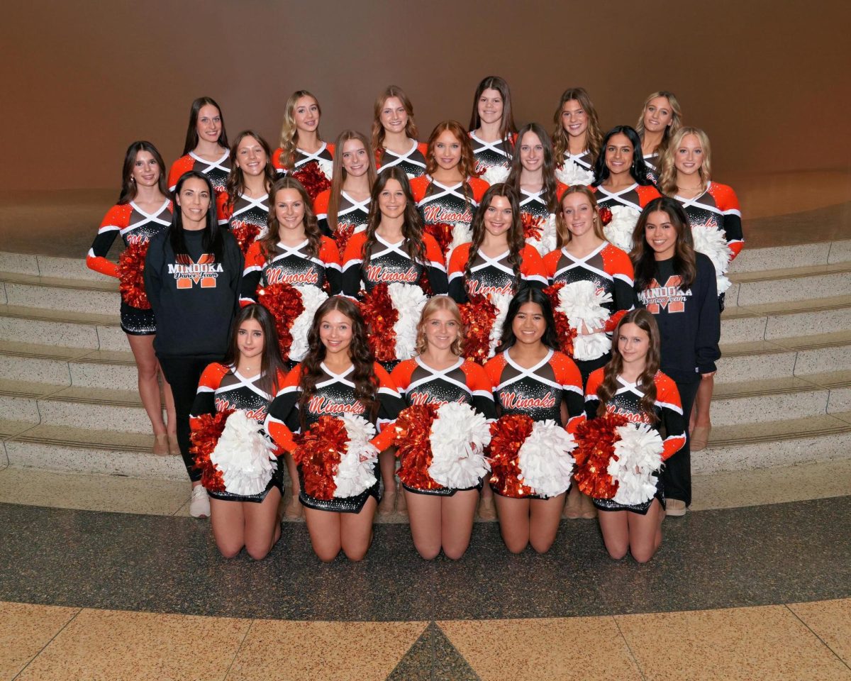 The head coach of the varsity dance team is Kerri Elkei. 